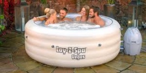 4 people sitting in a jacuzzi Lay Z spa