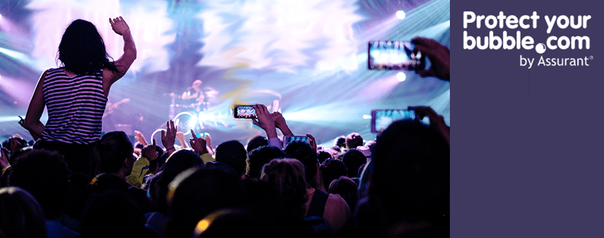 crowd watching a band filming on mobile phones